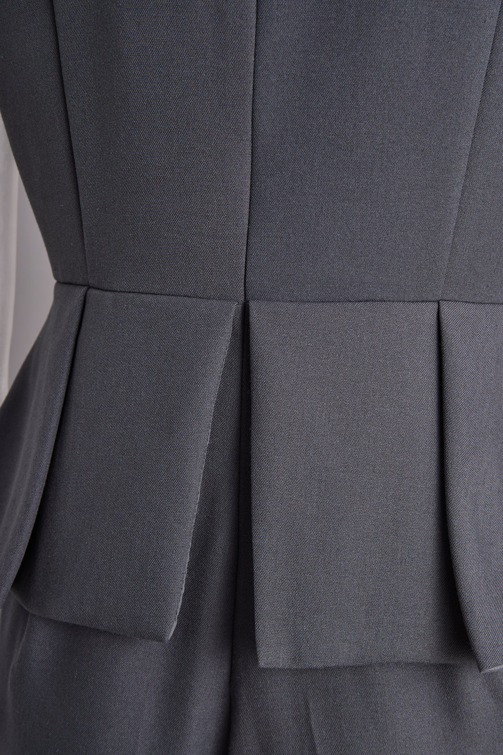 sophisticated-sleeveless-peplum-jumpsuit-in-charcoal-gray