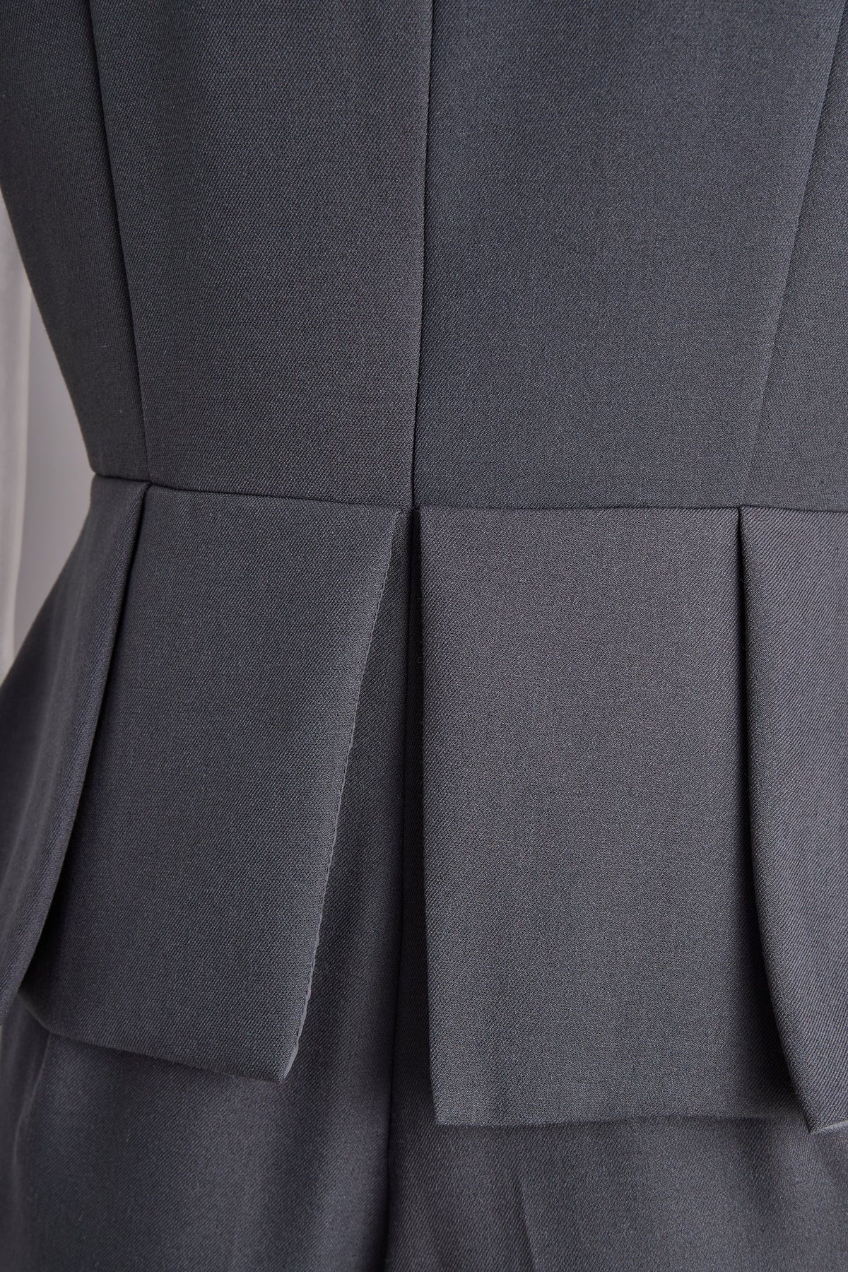 sophisticated-sleeveless-peplum-jumpsuit-in-charcoal-gray